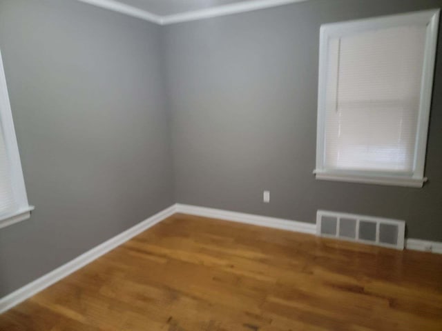 empty room with wood-type flooring