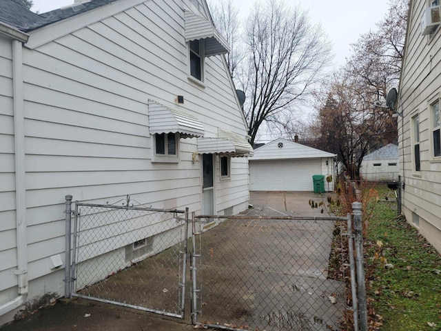 view of property exterior featuring a garage and cooling unit