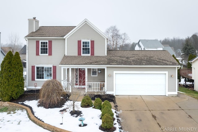 view of front of property with a garage and covered porch