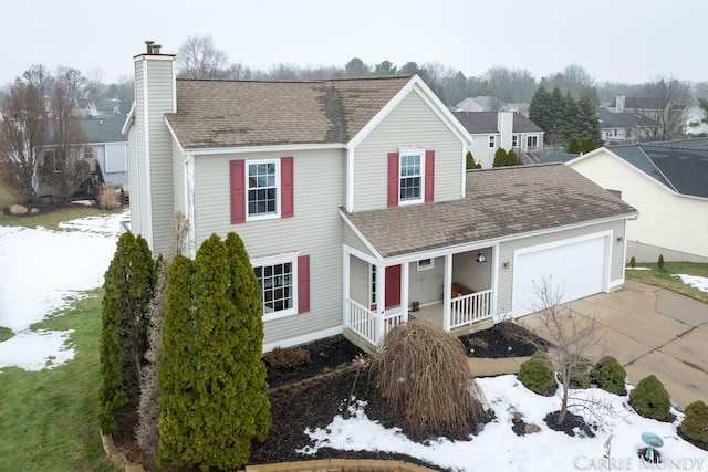 view of front facade with a garage and covered porch