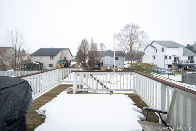 view of snow covered deck