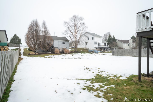 view of yard covered in snow