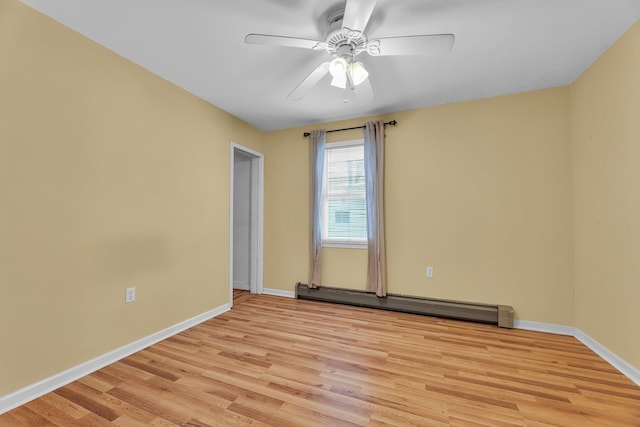 unfurnished room featuring ceiling fan, a baseboard heating unit, and light hardwood / wood-style floors