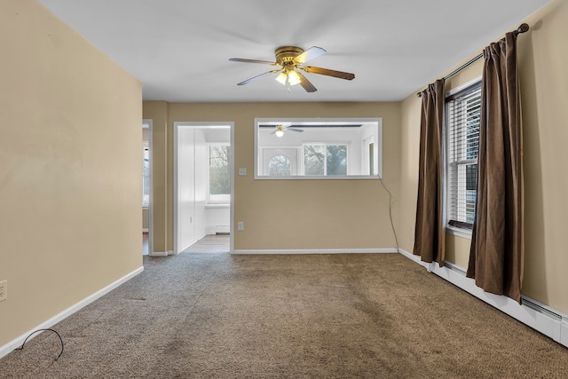 carpeted empty room with baseboard heating and ceiling fan