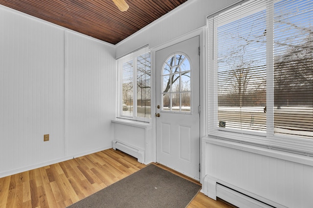 entryway with baseboard heating and light hardwood / wood-style flooring