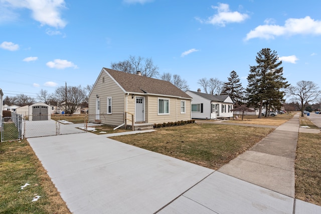 bungalow-style house with a front yard