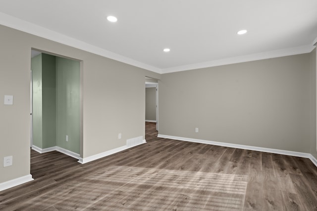 spare room with hardwood / wood-style floors and ornamental molding