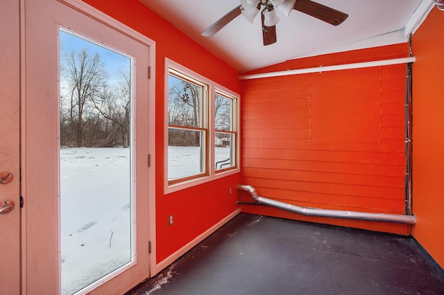 interior space featuring vaulted ceiling and ceiling fan