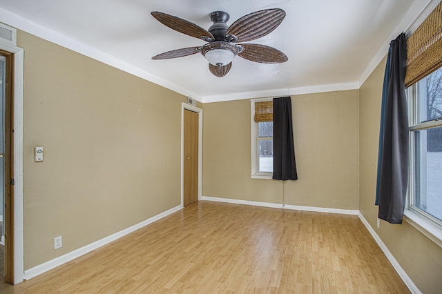 unfurnished room with ceiling fan and light hardwood / wood-style floors