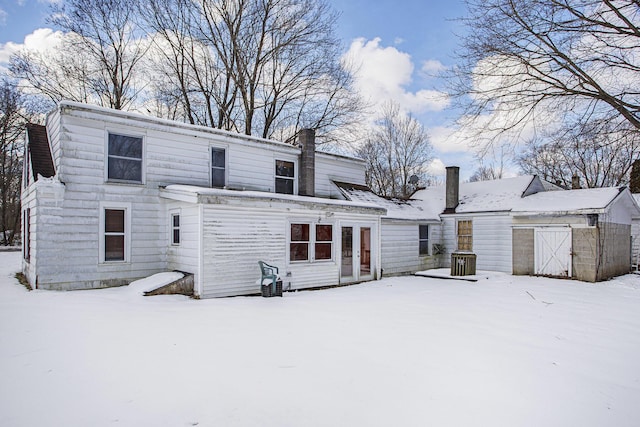 view of snow covered house