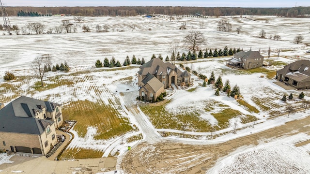 snowy aerial view featuring a rural view