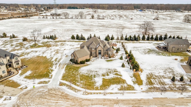 snowy aerial view featuring a rural view