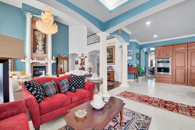 tiled living room with ornate columns and ornamental molding