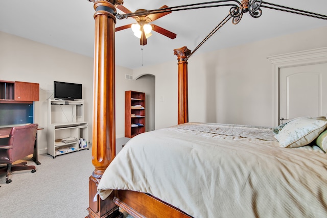 bedroom with ornate columns and carpet flooring