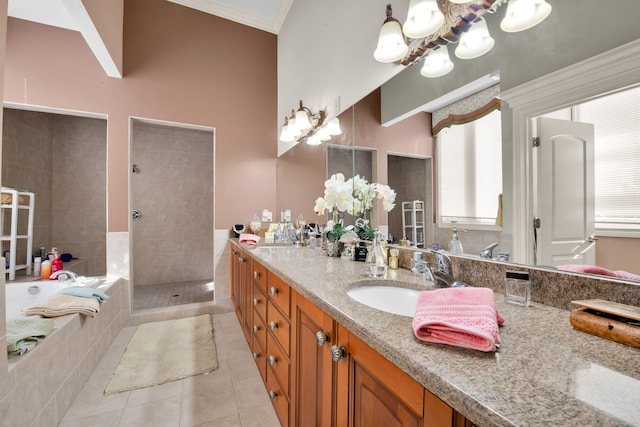 bathroom with lofted ceiling, tile patterned floors, crown molding, vanity, and independent shower and bath