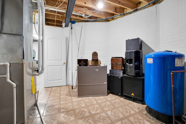 basement featuring brick wall