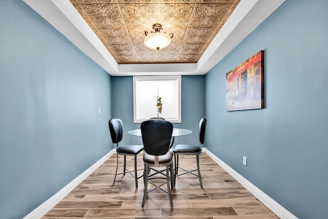 dining room featuring a raised ceiling