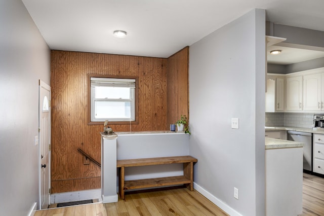 interior space featuring tasteful backsplash and hardwood / wood-style flooring