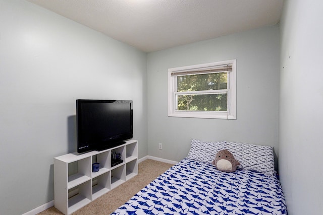 bedroom featuring light colored carpet