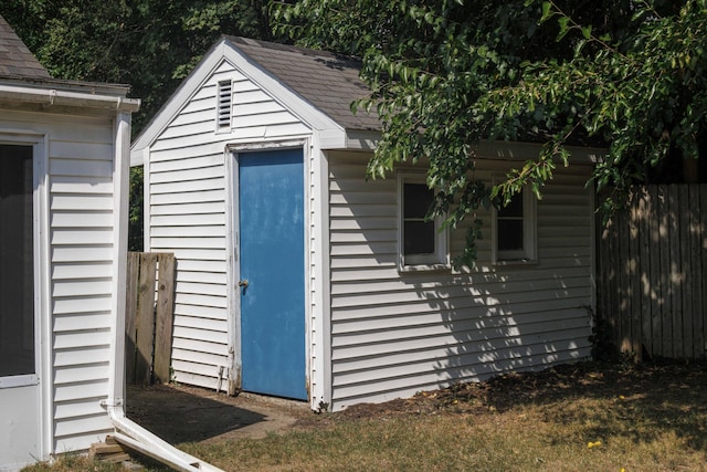 view of outbuilding with a lawn