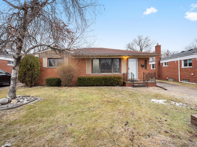 ranch-style home with a front yard