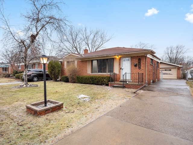 view of front of property featuring a garage and a front lawn