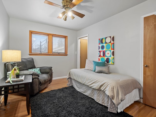 bedroom with hardwood / wood-style floors and ceiling fan