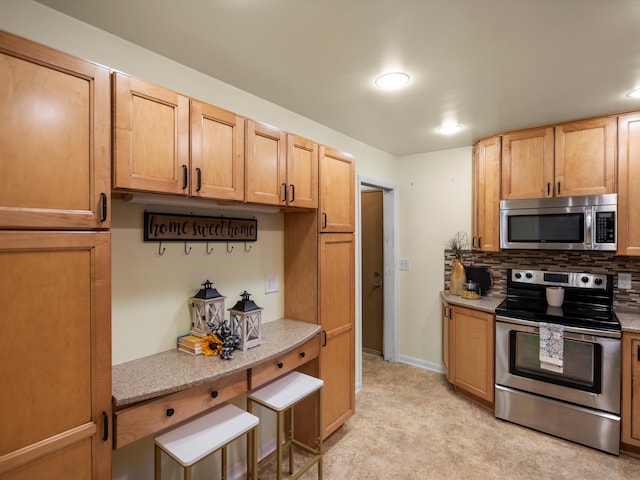 kitchen with tasteful backsplash, stainless steel appliances, and light stone countertops