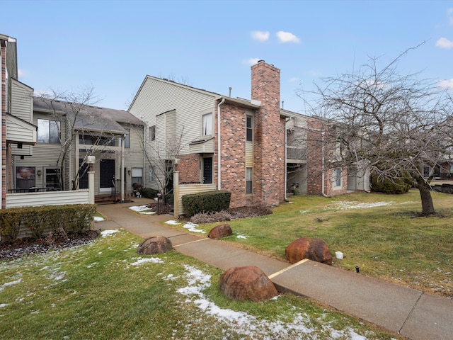 view of home's exterior with a lawn