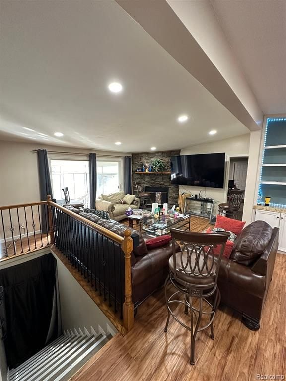 living room with a fireplace and light hardwood / wood-style floors