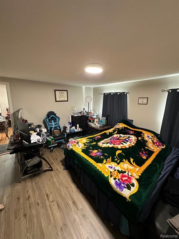 bedroom featuring hardwood / wood-style floors