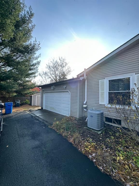 garage featuring central air condition unit