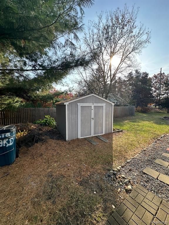 view of outdoor structure featuring a lawn