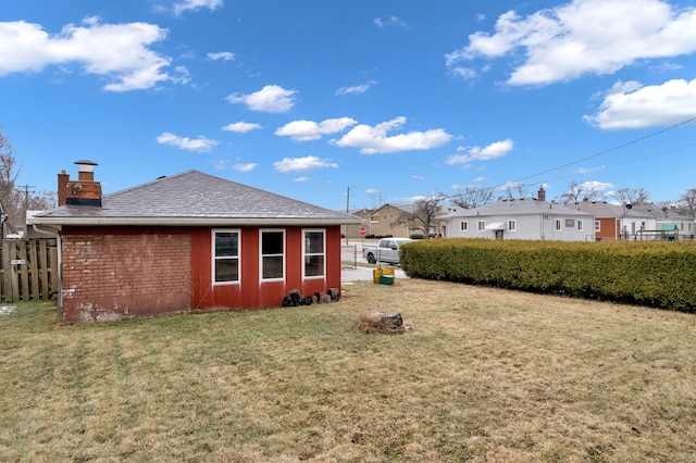 rear view of house with a lawn