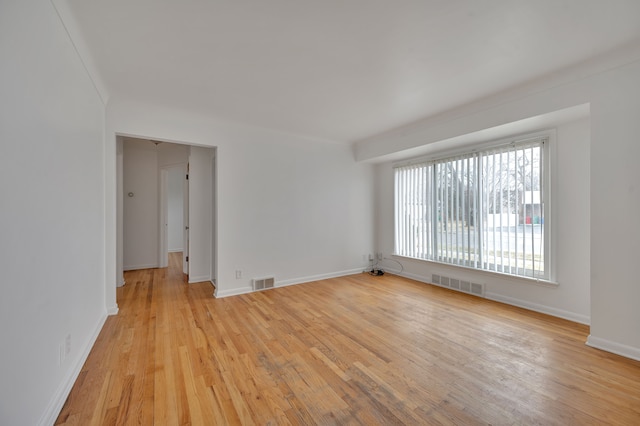 spare room with light wood-type flooring