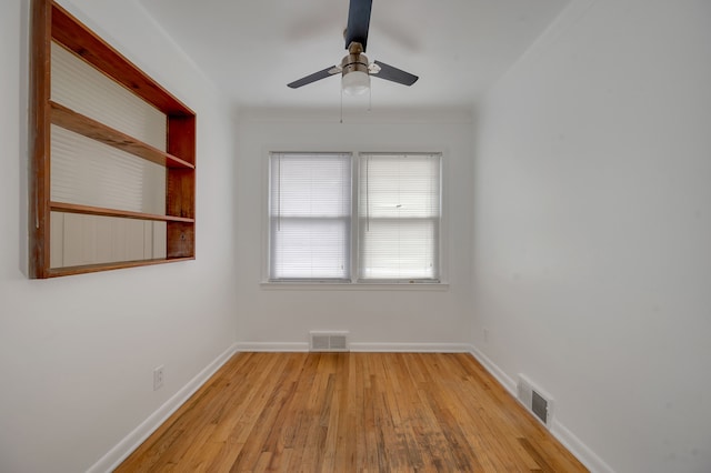 unfurnished room with ceiling fan and light hardwood / wood-style flooring