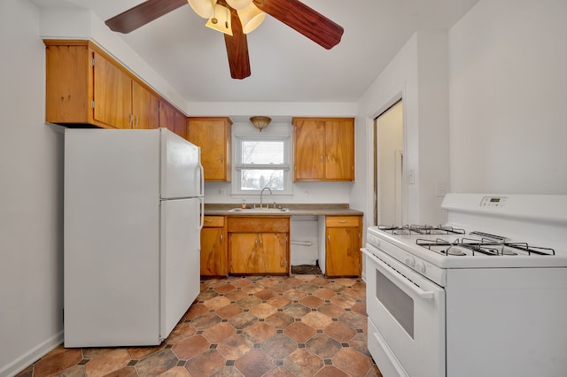 kitchen featuring ceiling fan, white appliances, and sink