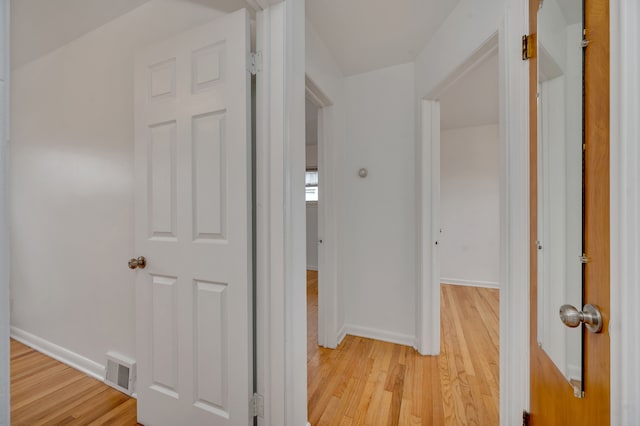 hallway featuring light hardwood / wood-style flooring