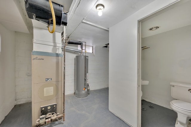 interior space featuring toilet, concrete flooring, and gas water heater