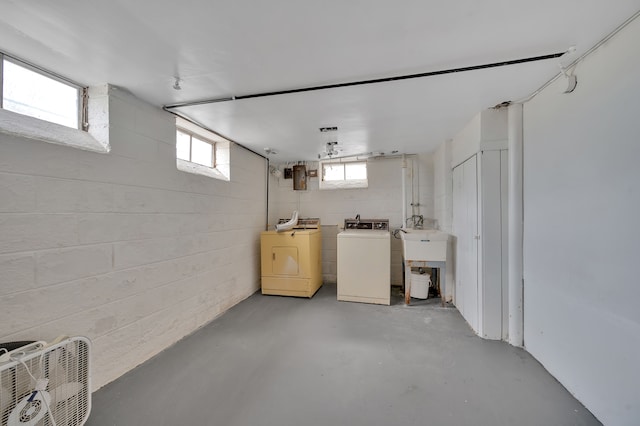 basement with washer and dryer and sink