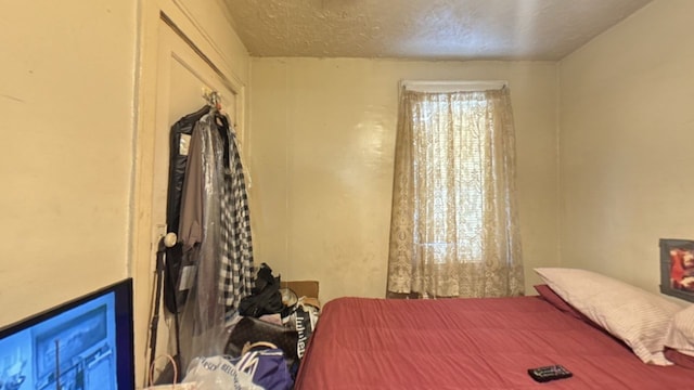 bedroom featuring a textured ceiling