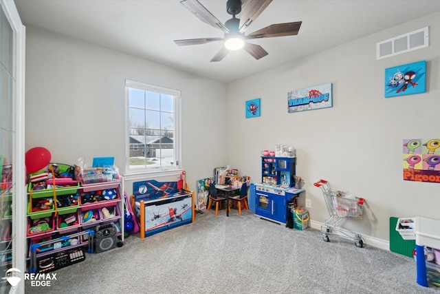 recreation room with carpet flooring and ceiling fan