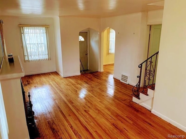 unfurnished room featuring hardwood / wood-style floors