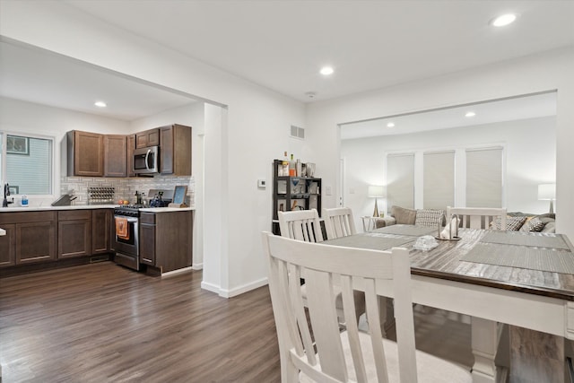 dining area featuring dark hardwood / wood-style floors