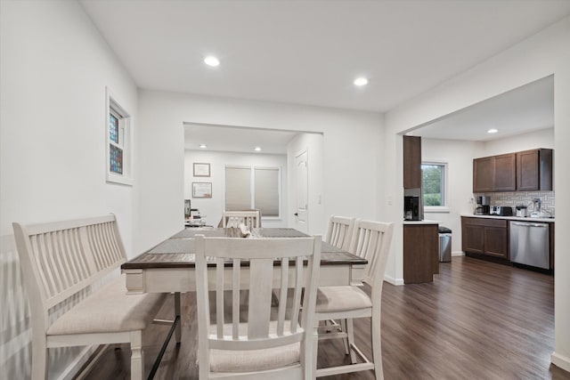 dining area with dark hardwood / wood-style floors