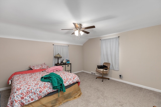 carpeted bedroom with lofted ceiling and ceiling fan