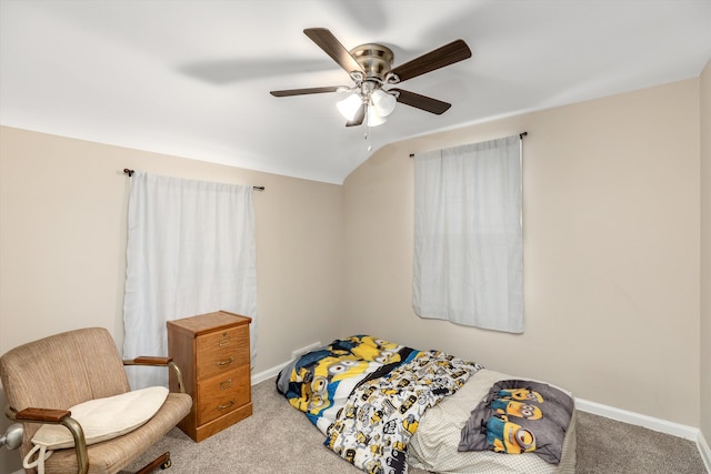 carpeted bedroom featuring vaulted ceiling and ceiling fan