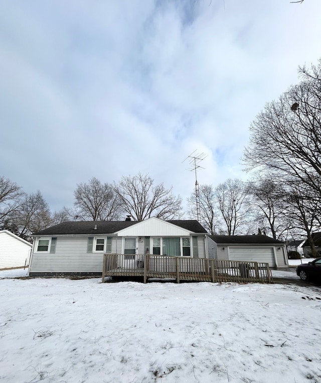 view of front facade featuring a garage and a deck