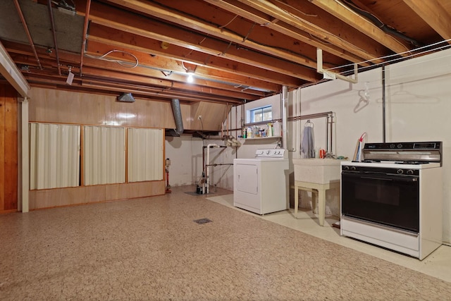 basement with washing machine and clothes dryer