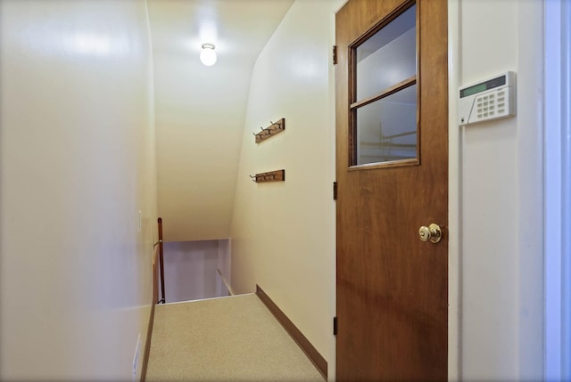 hallway featuring an upstairs landing